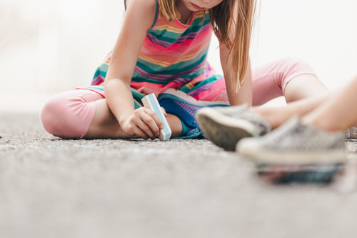 files/little-girl-drawing-with-chalk-on-ground.jpg
