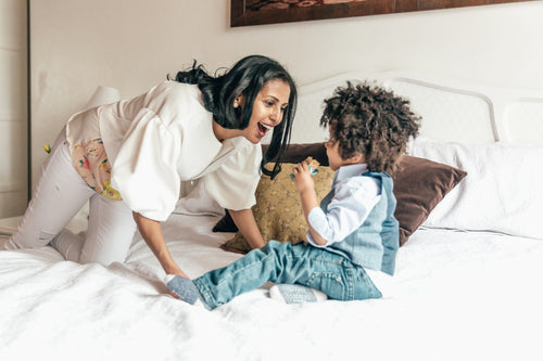 files/mother-playing-with-son-in-bedroom.jpg